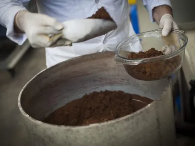 Washed gold precipitate being weighed out